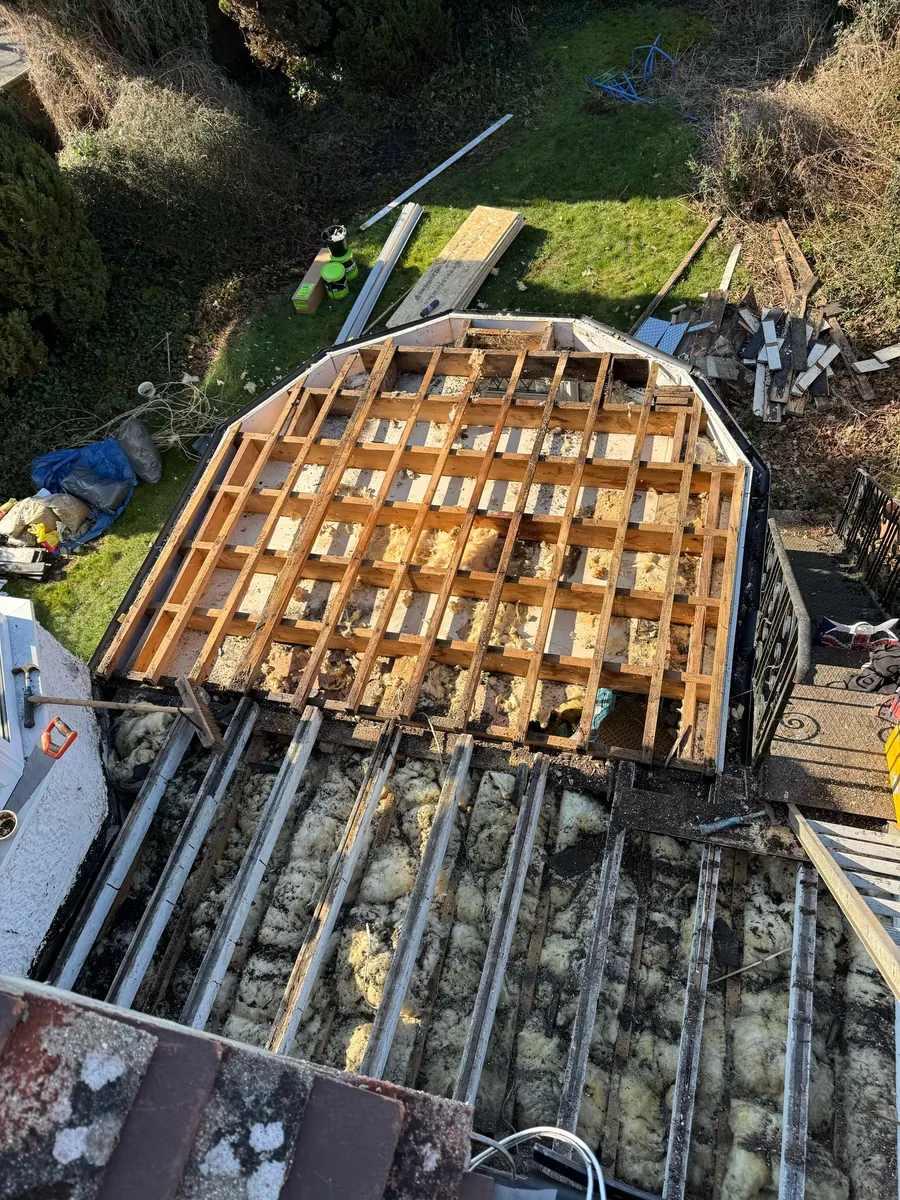Bay roof opened up to the joists for rebuilding