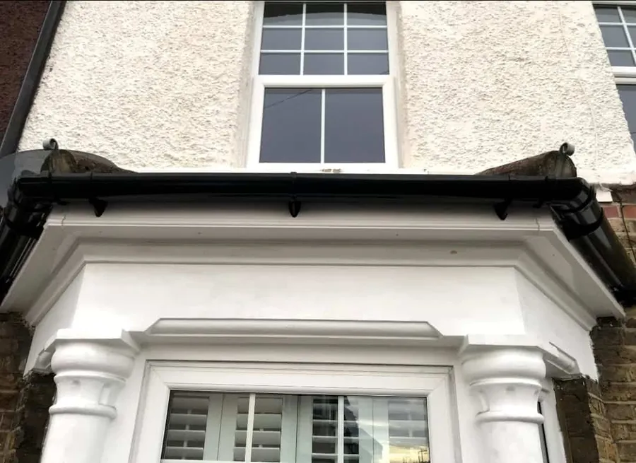 Bay window and porch after exterior painting