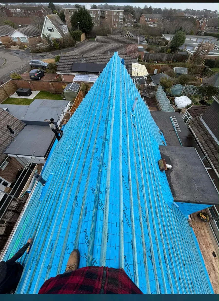 New blue membrane and battens, seen from the ridge