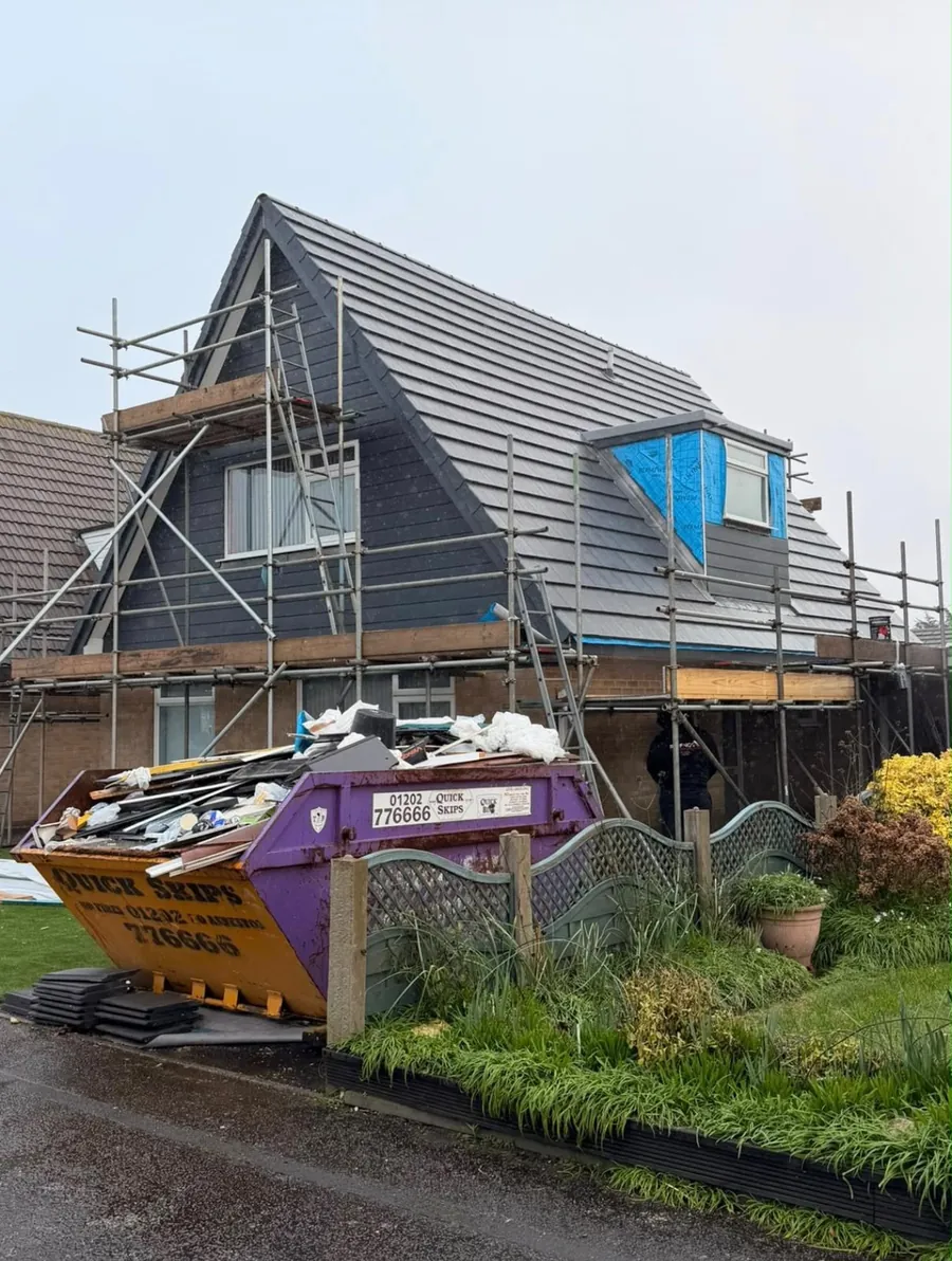 Chalet re-roof under way with scaffold and a skip