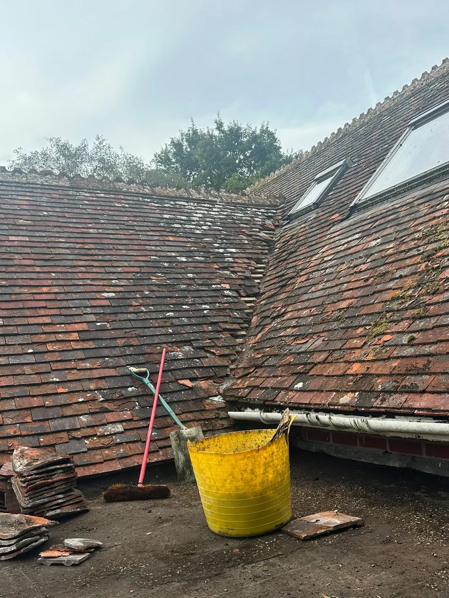 Old clay tile valley being repaired
