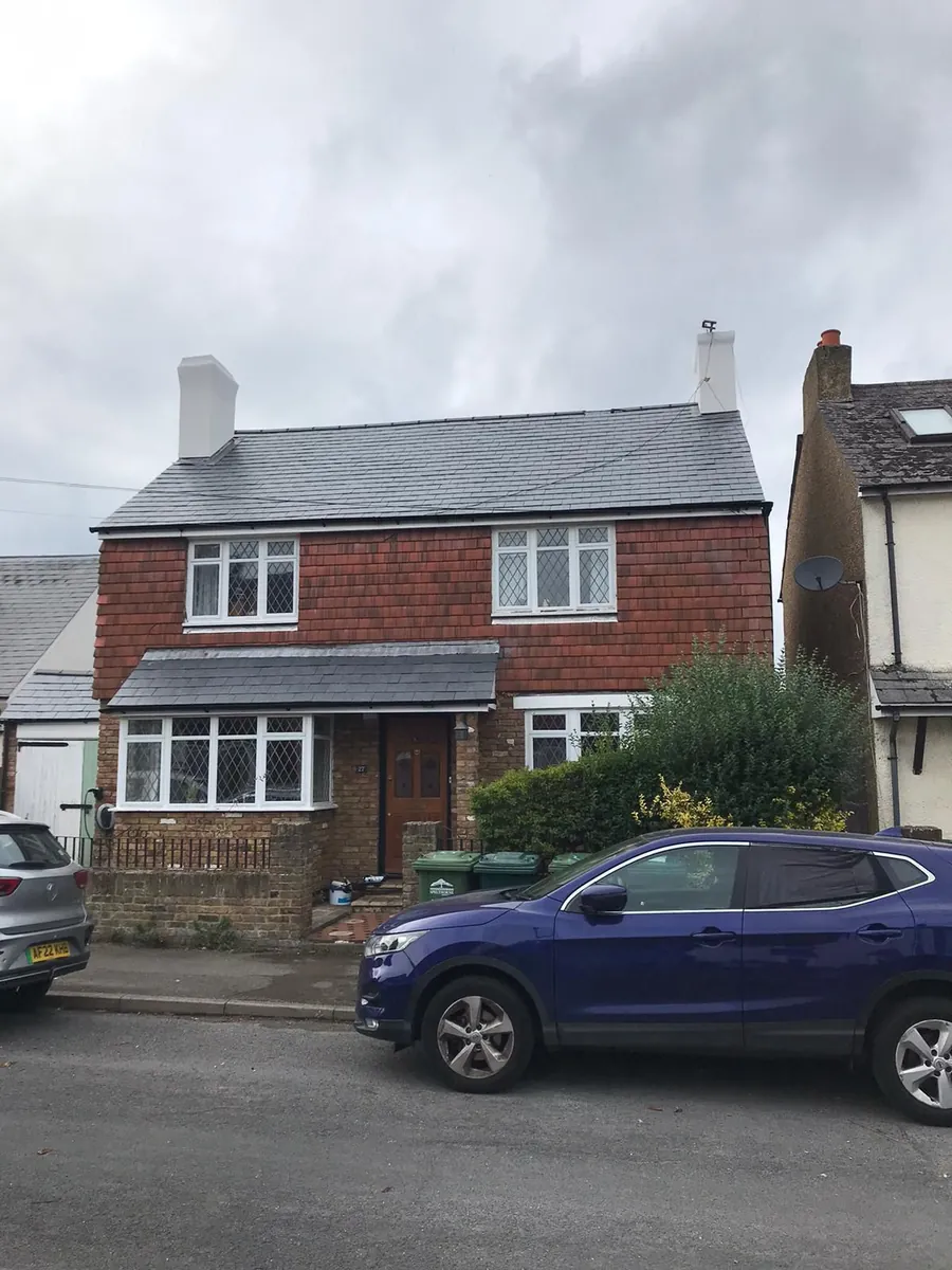 Detached house with a finished grey roof
