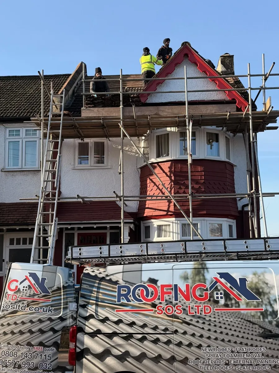 Team re-roofing an Edwardian gable behind a Roofing SOS Ltd scaffold banner