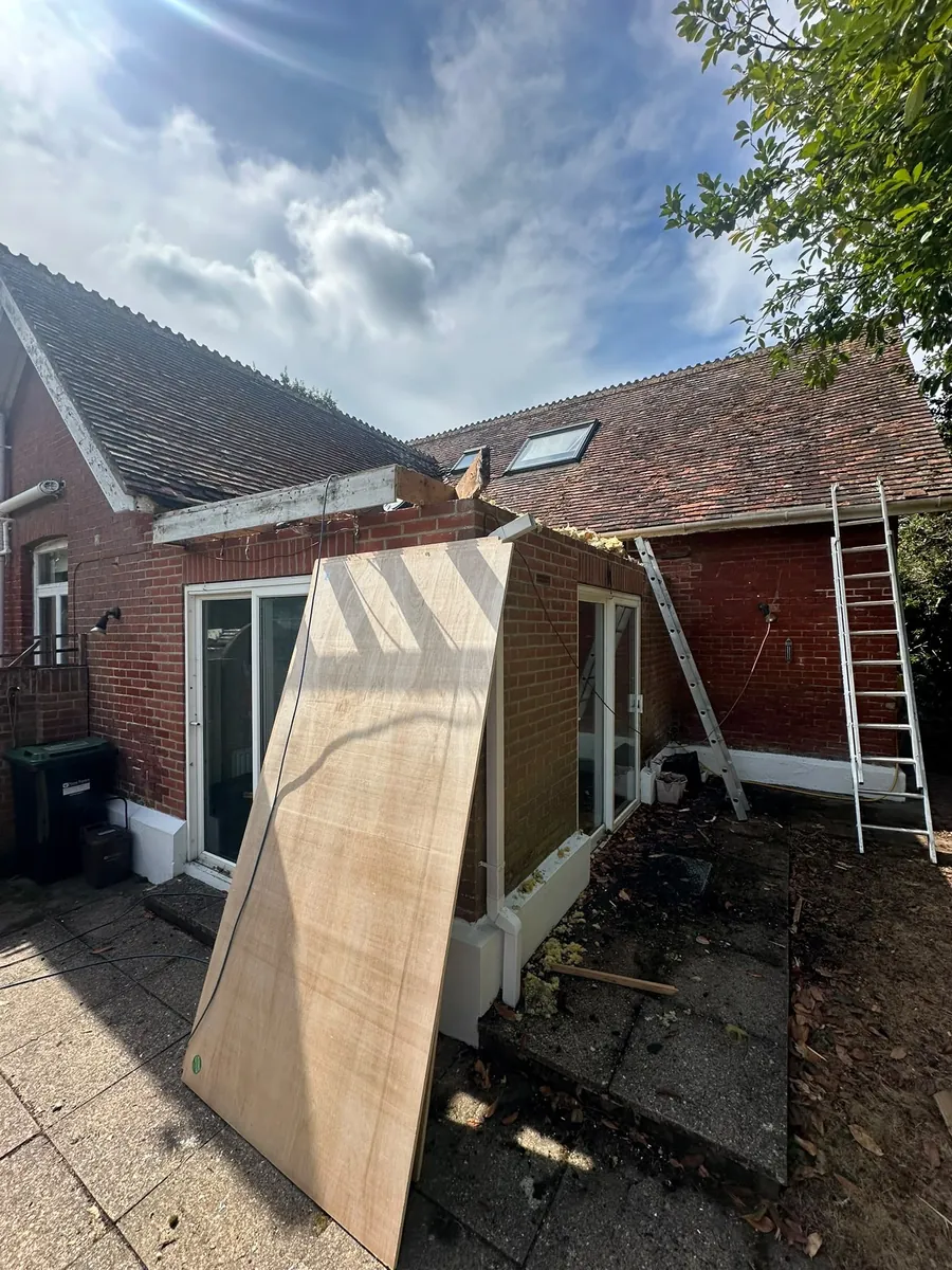 Boards going up on a single-storey extension roof