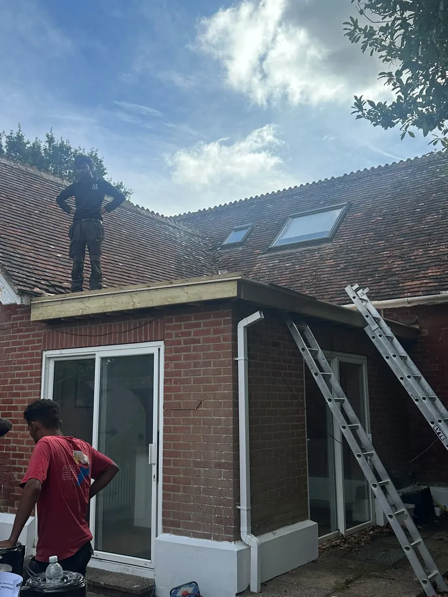 Single-storey extension with a new roof and white fascias