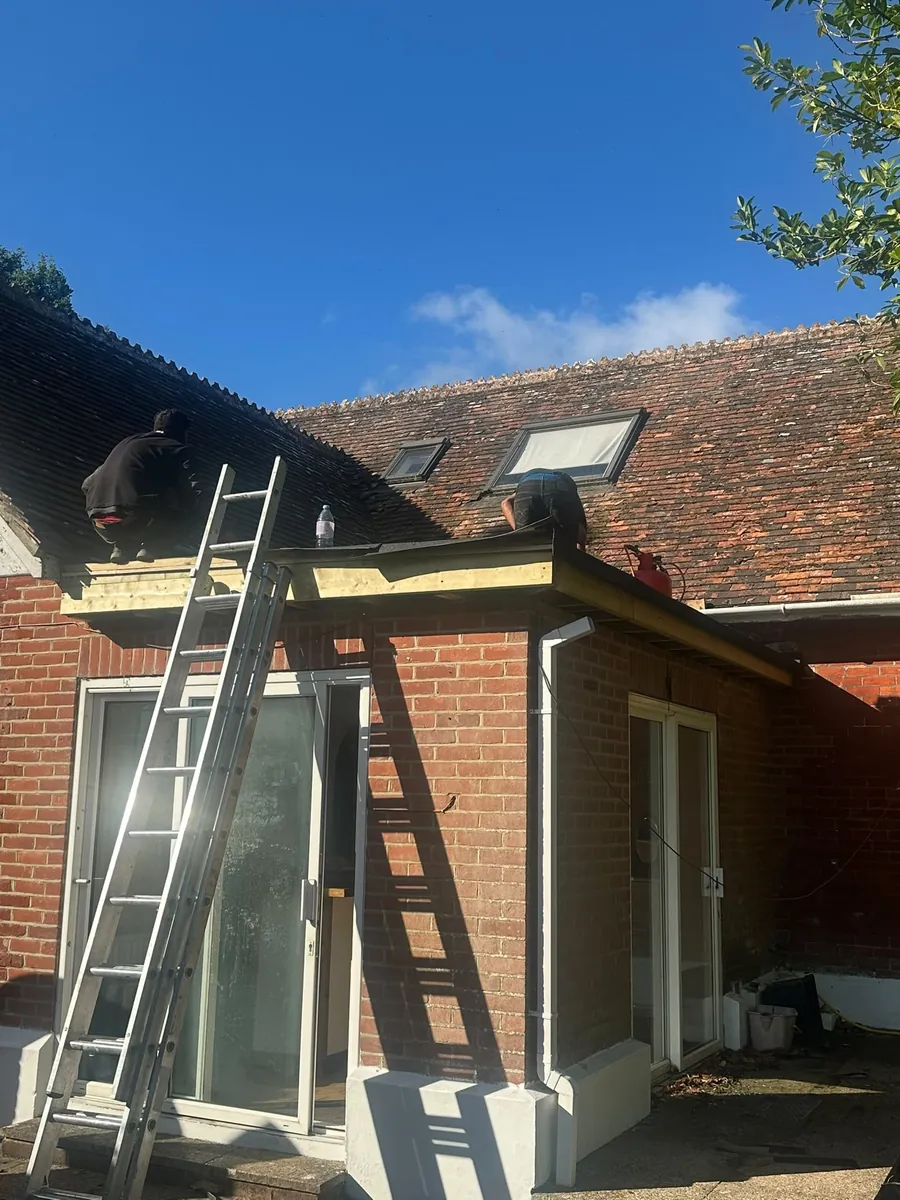 Extension roof work with ladder access at the eaves