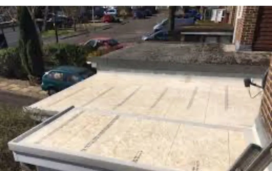 New flat roof deck boarded and ready for the covering