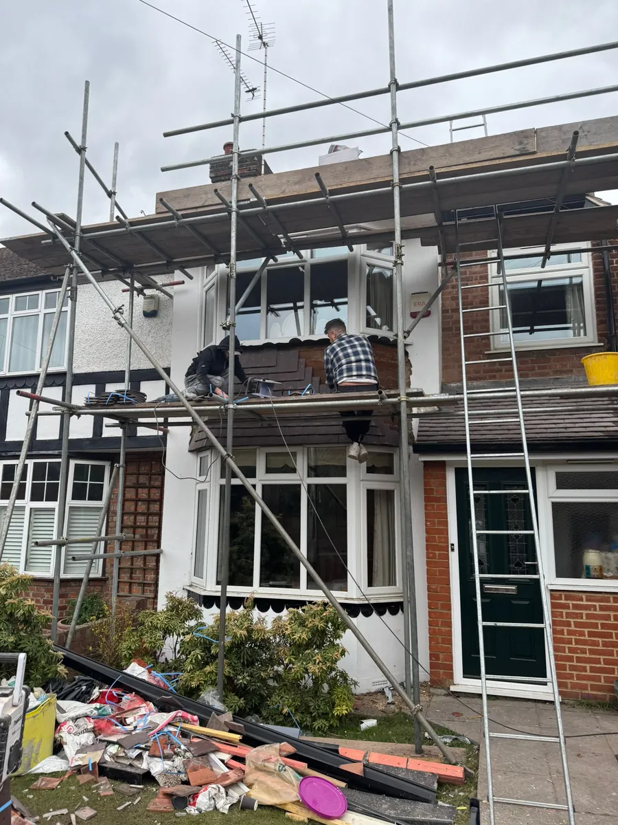 Mock-Tudor semi under scaffold for exterior work