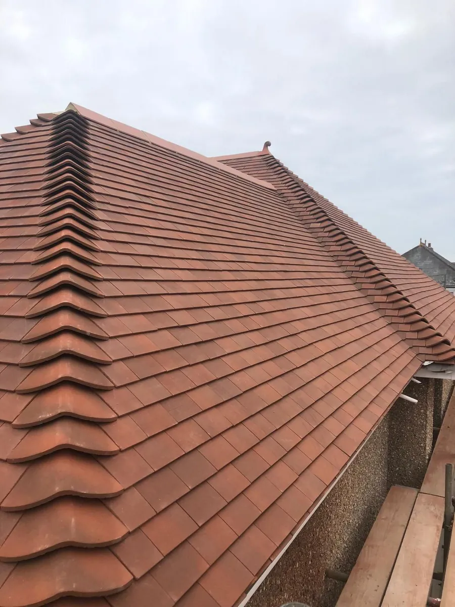 New plain clay tiles and ridge on a re-roof