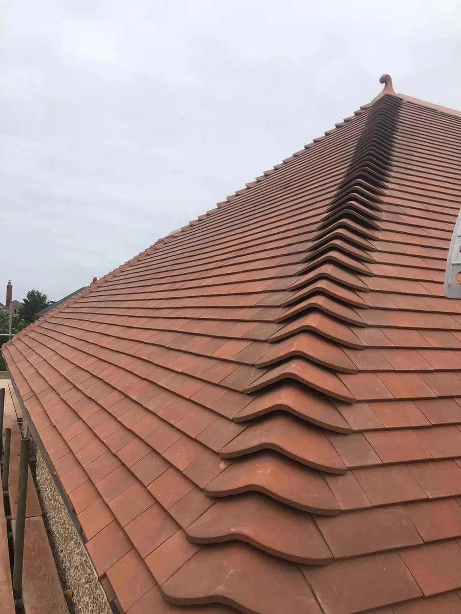 Finished plain tile roof with new ridge tiles