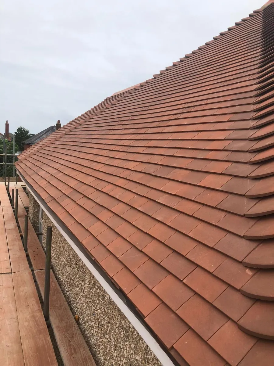 Plain tile slope finished down to the gutter