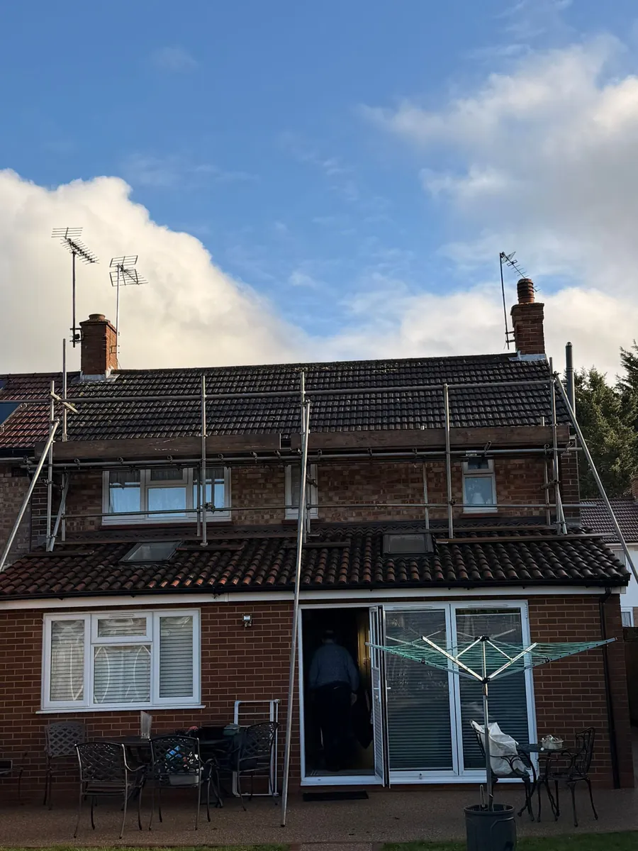 Rear of a house under scaffold for roof work