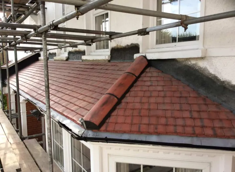 Red tiled bay roof and dormer cheek