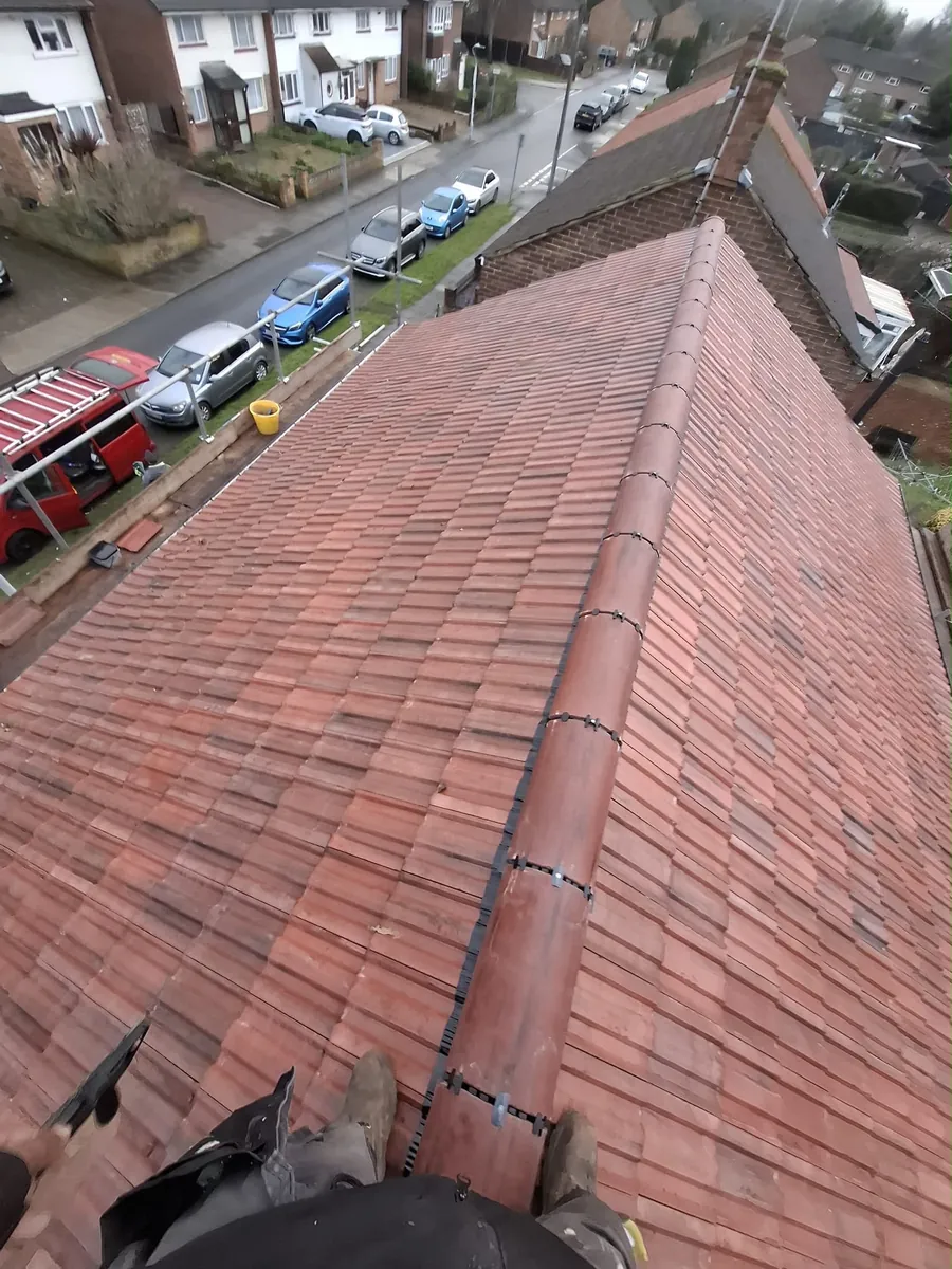 Long red tile roof seen from the ridge
