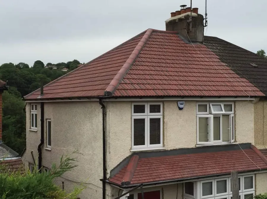 Finished red tiled roof on a semi-detached house