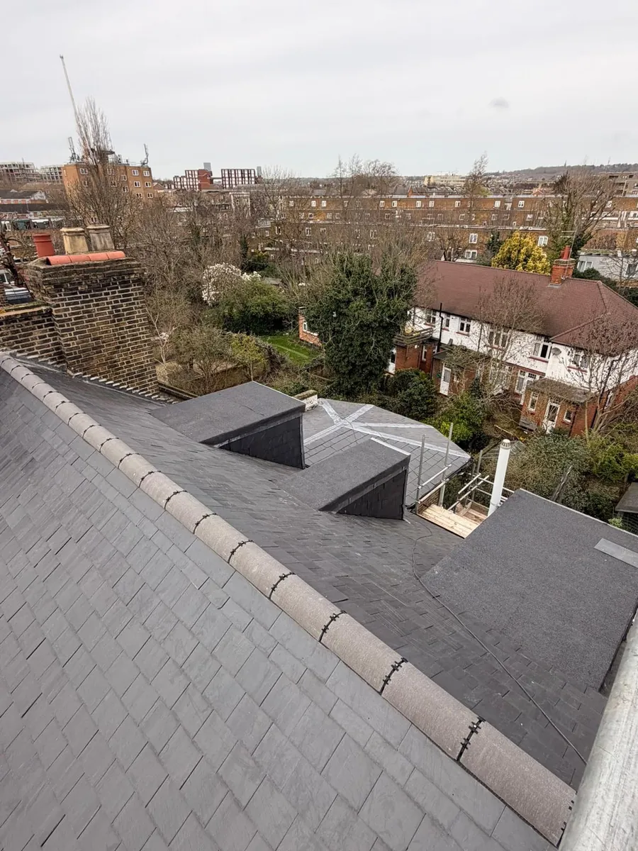 Slate roof with new dormers above north London rooftops