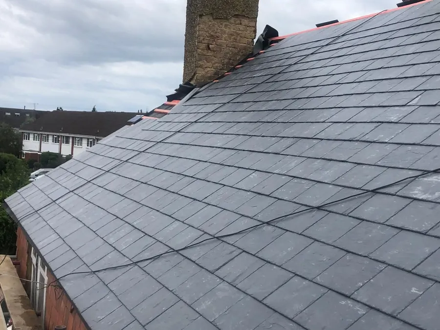 Slate slope with a new ridge running to the chimney