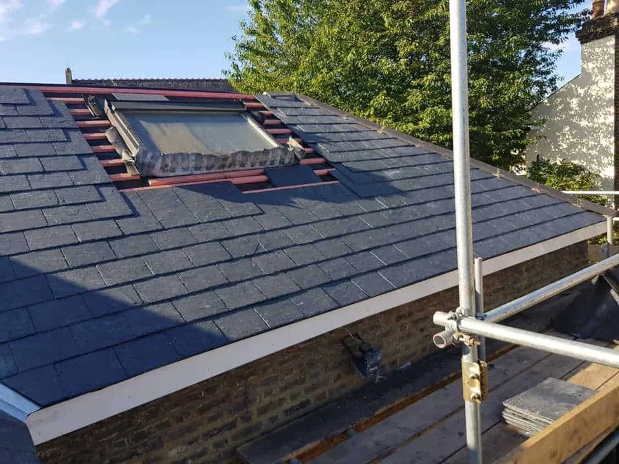 Slate roof with a new roof window and flashing