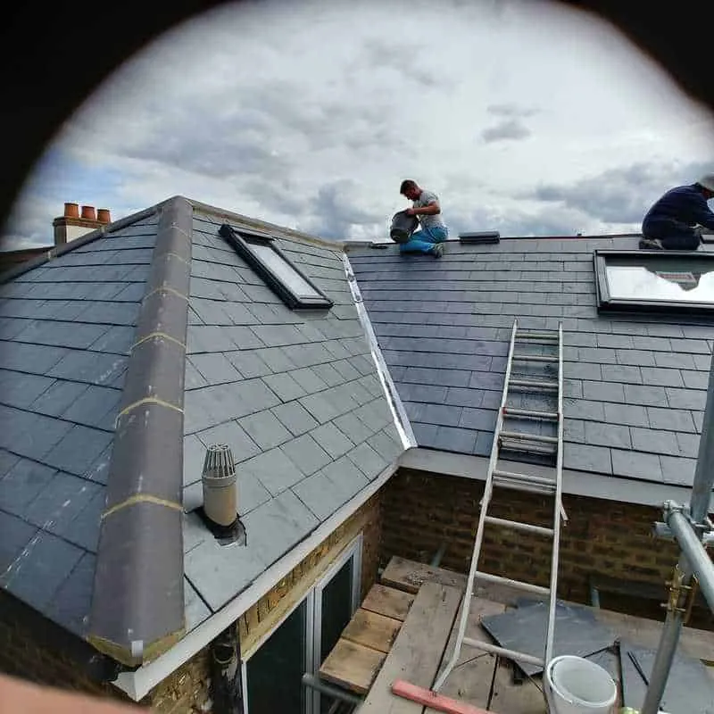 New slate roof with roof windows, seen from the scaffold