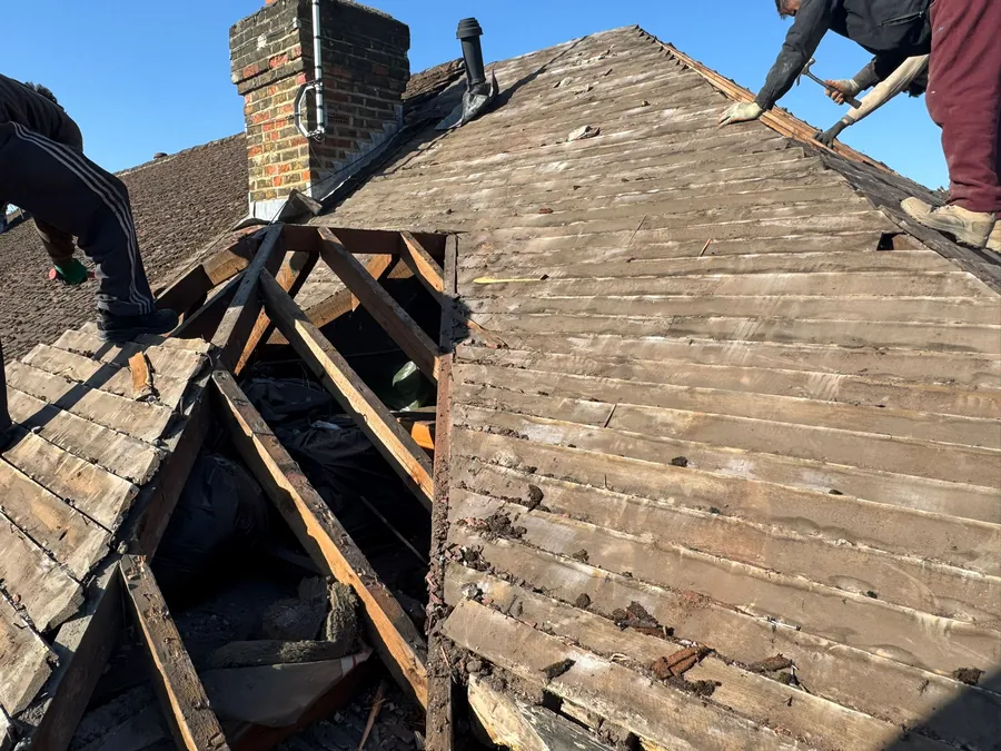 Old roof stripped back to the boards and rafters