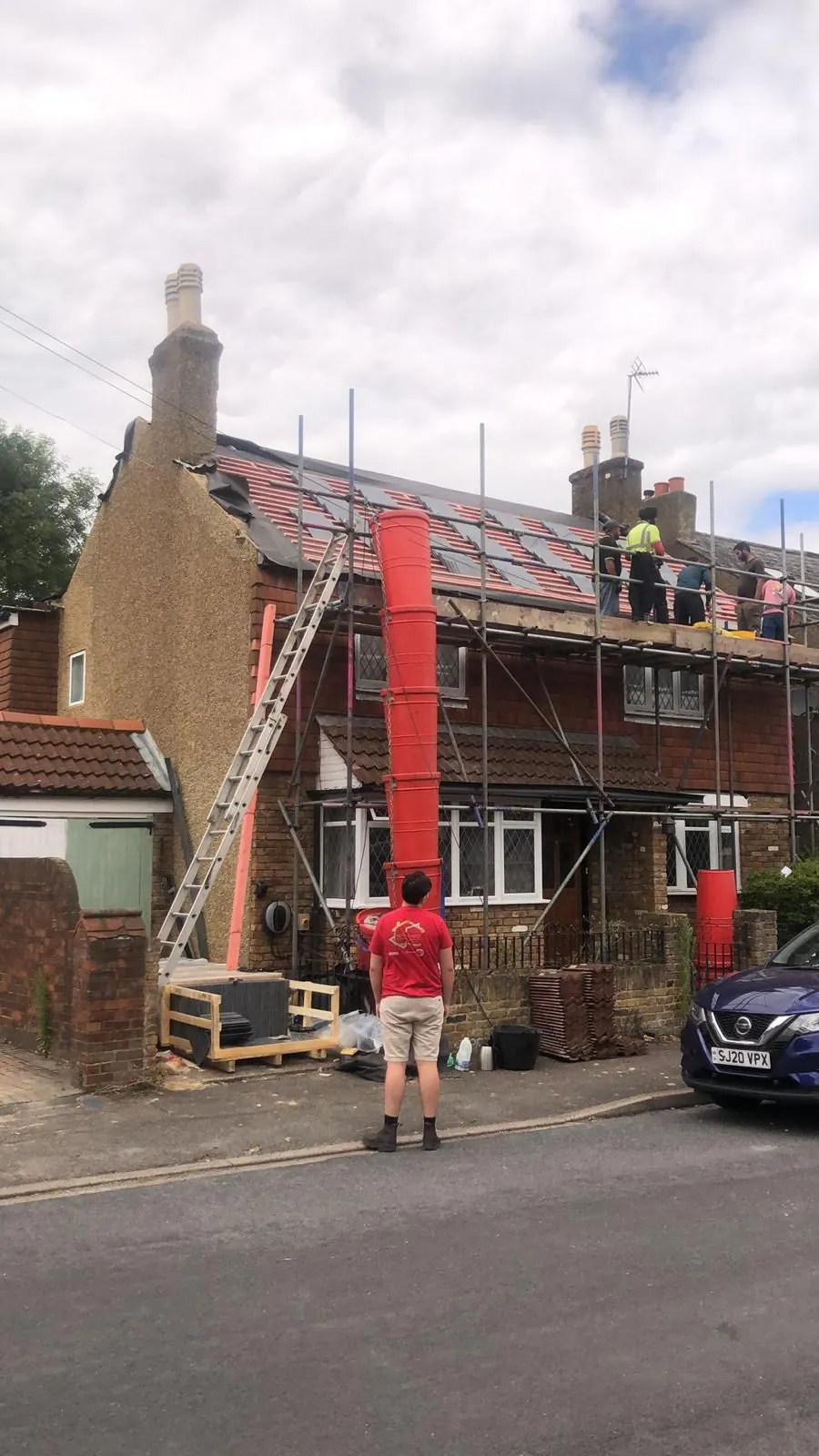 Re-roof on a terrace with scaffold and rubbish chute